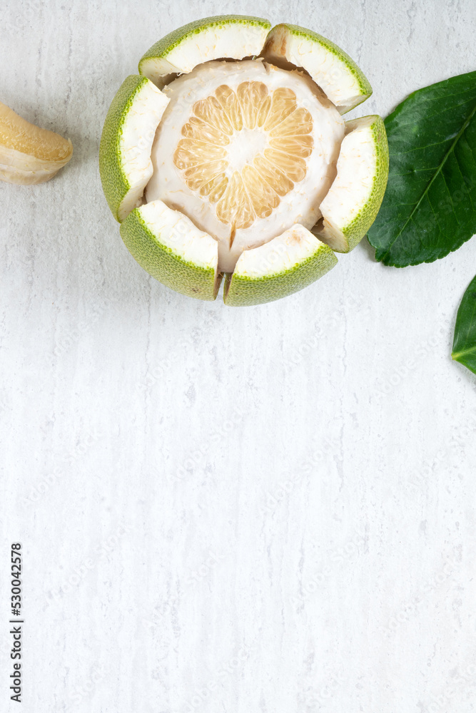 Fresh pomelo fruit on white table background.