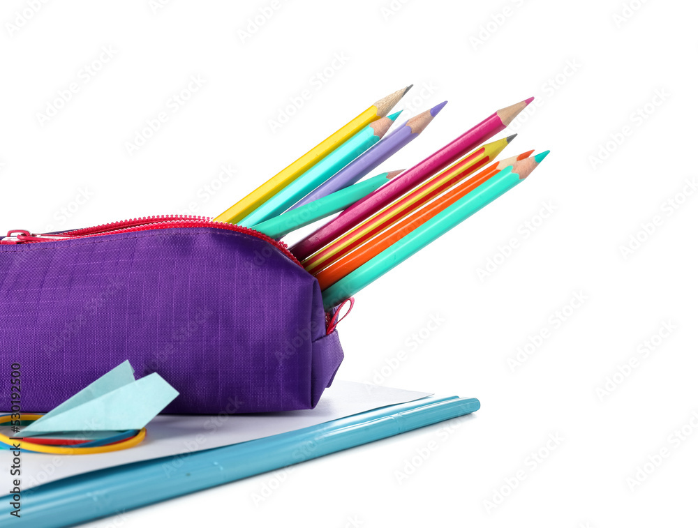 Purple case with pencils and paper plane on white background