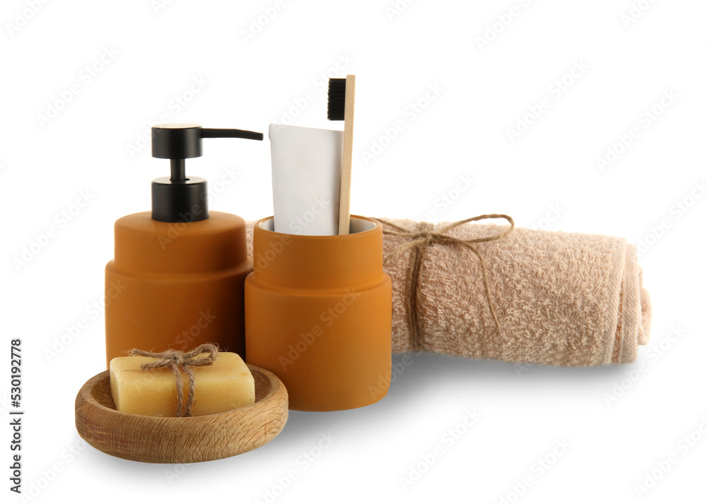 Set of bath supplies with towel on white background