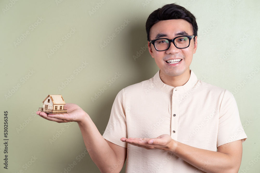 Photo of young Asian man on background