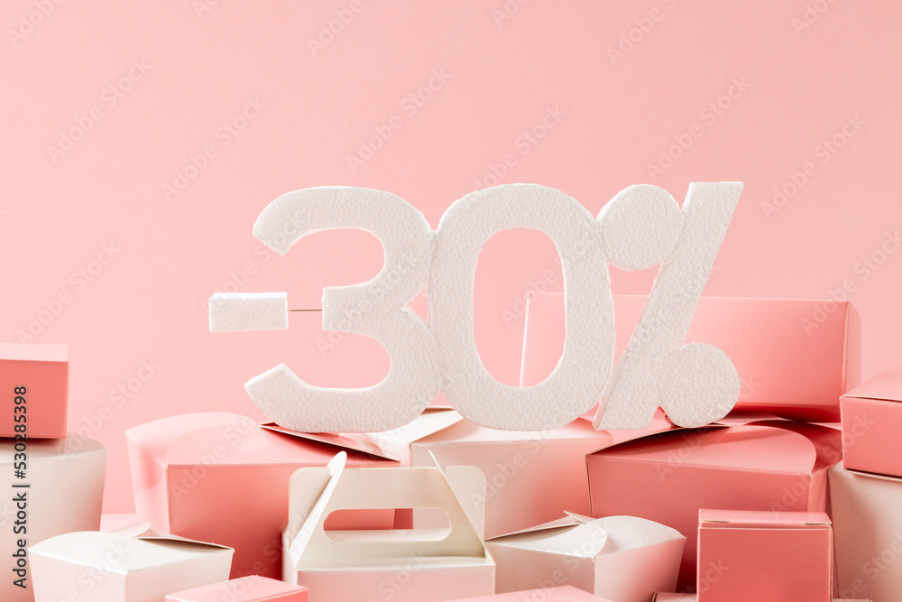 Composition of -30 percent with boxes on pink background