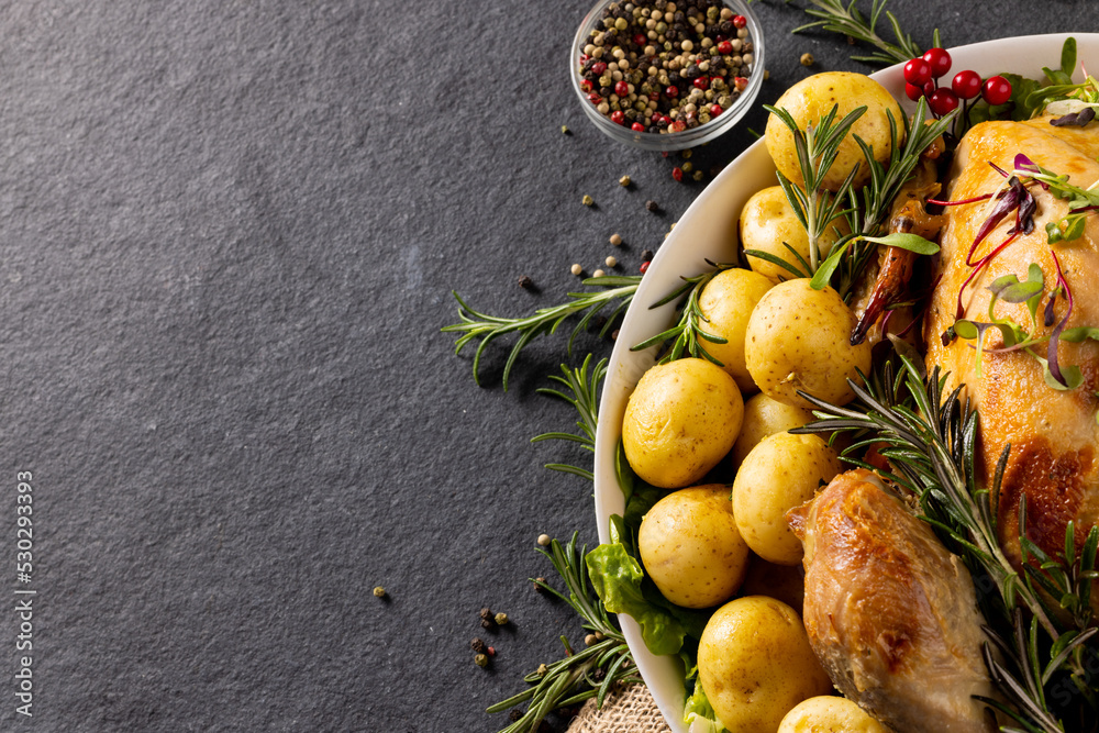 Overhead view of thanksgiving roast turkey with potatoes and copy space on grey background