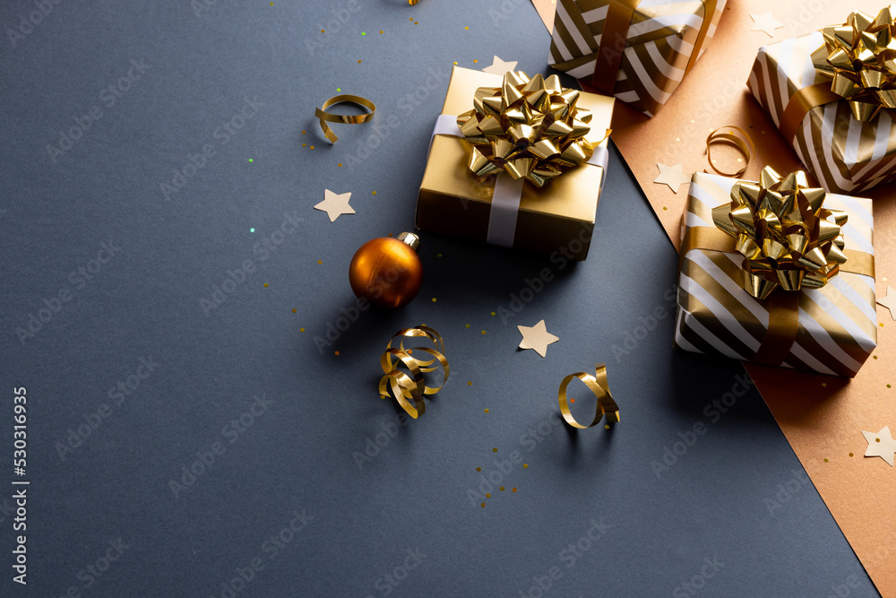 Image of christmas decoration with gifts and copy space on black background