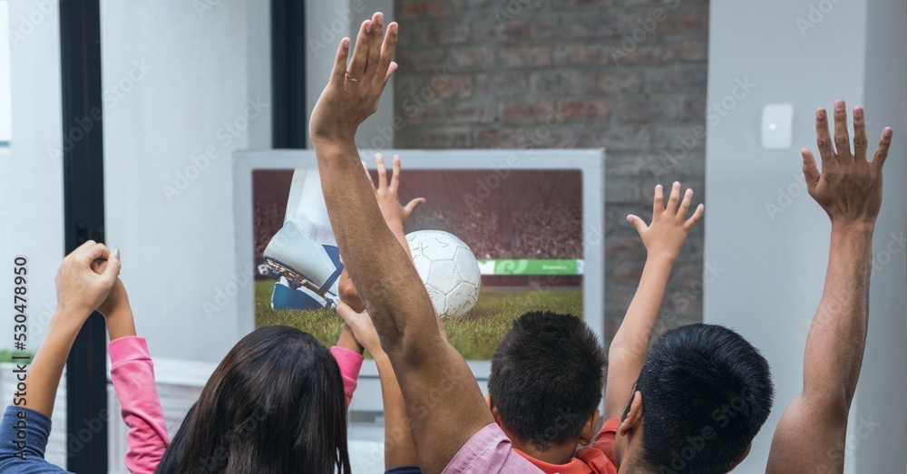 Composition of family of sports fans watching football match on tv, cheering with arms in the air