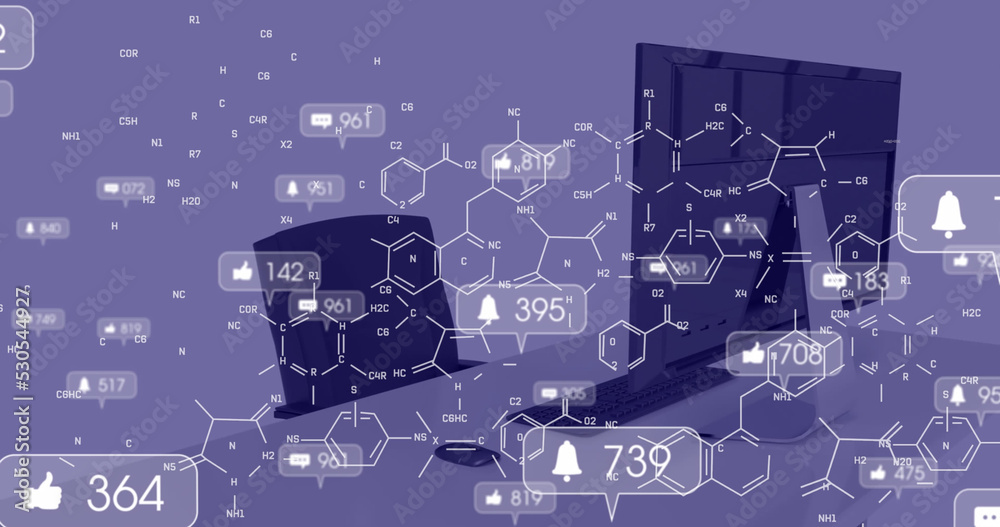 带有数字和化学式的社交媒体图标的图片放在桌子上，放在电脑上