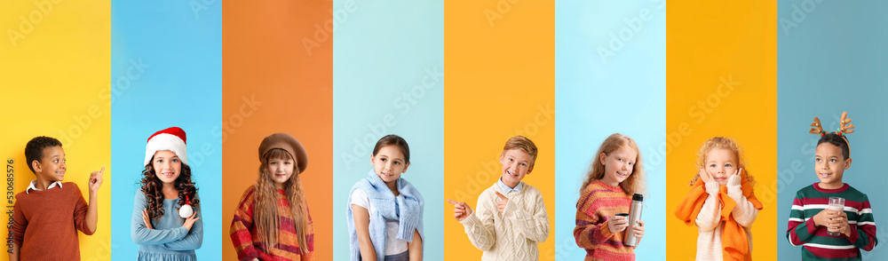 Set of children in warm clothes on colorful background