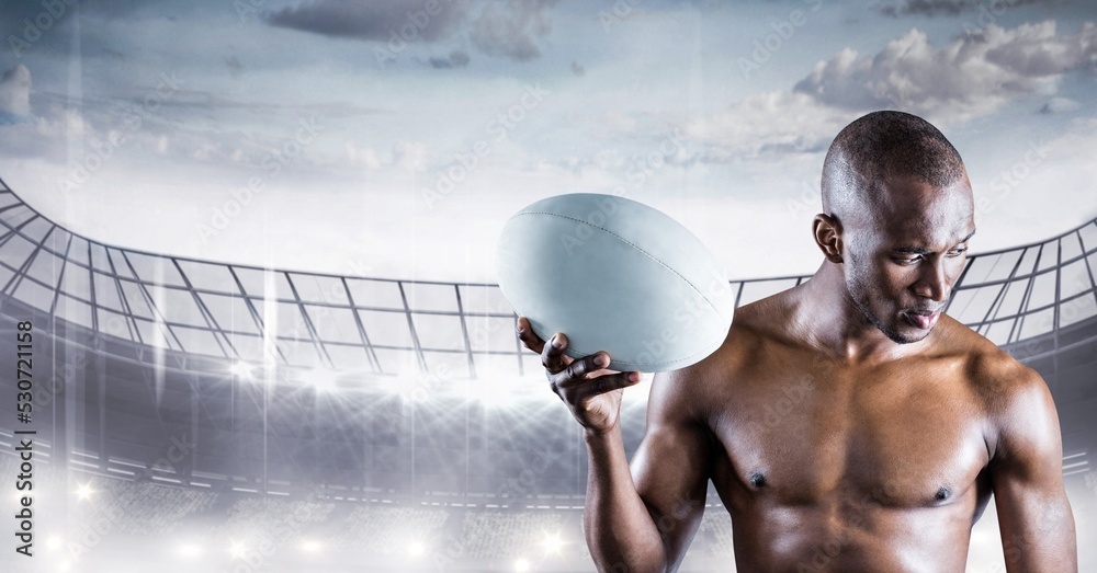 Composition of shirtless male rugby player holding rugby ball over sports stadium