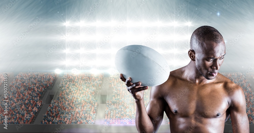 Composition of shirtless male rugby player holding rugby ball over sports stadium