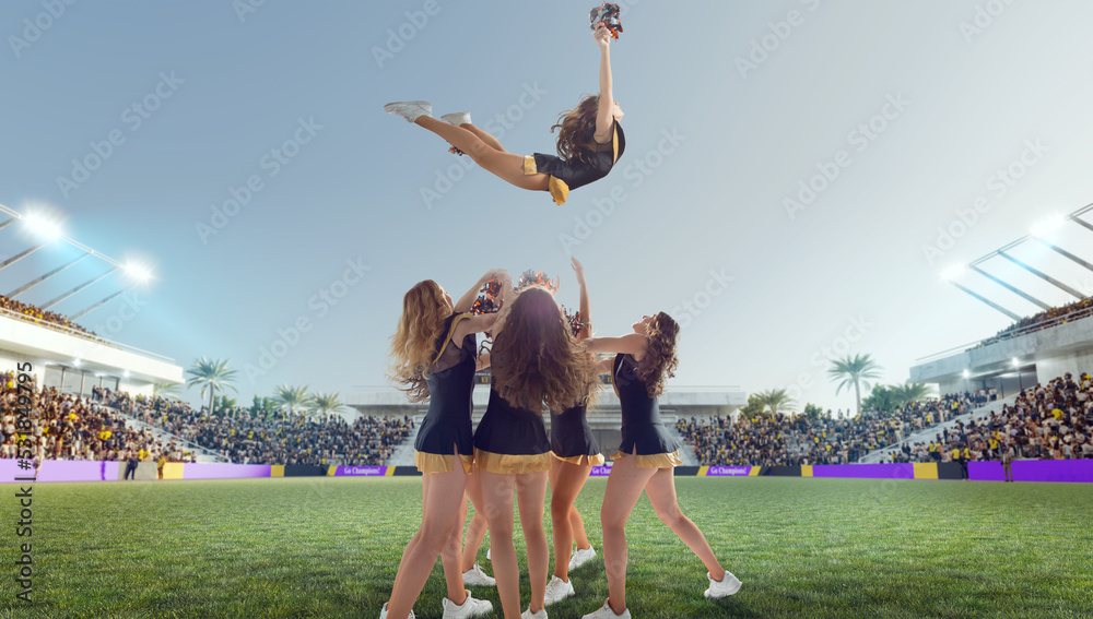 Group of cheerleaders in action on  stadium