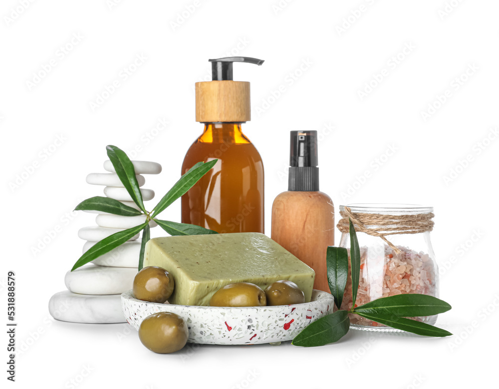 Set of natural cosmetic products with spa stones on white background