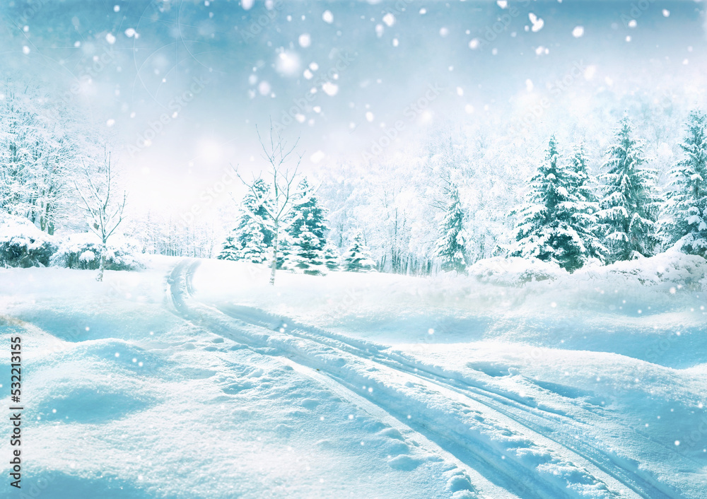 Beautiful landscape with cold winter forest with snowdrifts, light snowfall and snow-covered road st