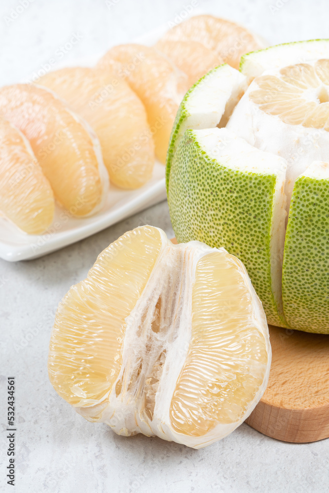 Fresh pomelo fruit on white table background.