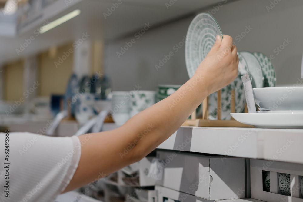 woman buying cutlery in mall