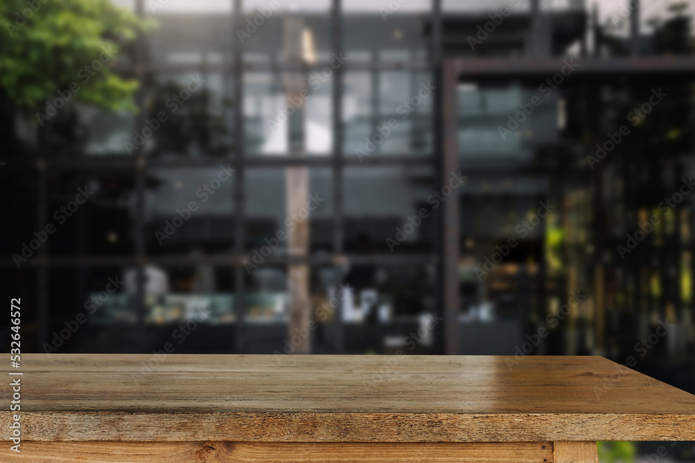 Empty dark wooden table in front of abstract blurred bokeh background of restaurant . can be used fo