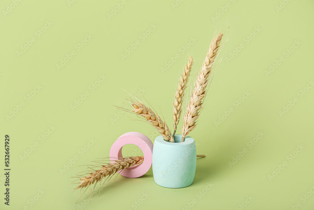 Showcase pedestals and wheat ears on green background