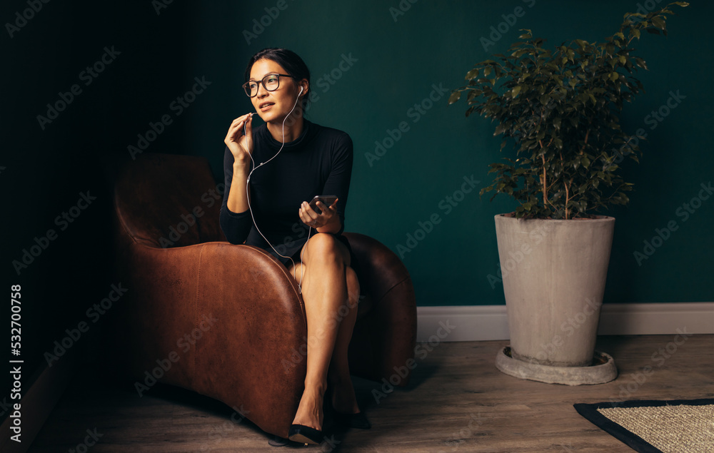 Beautiful young businesswoman talking on phone