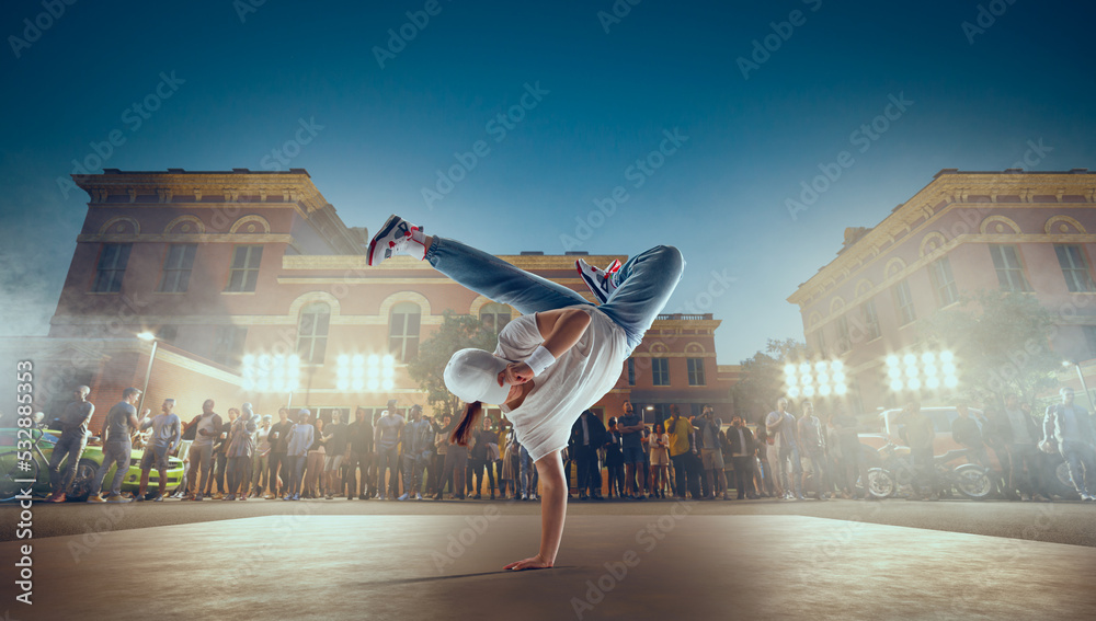 Street dancer girl  dance breakdance on evening street