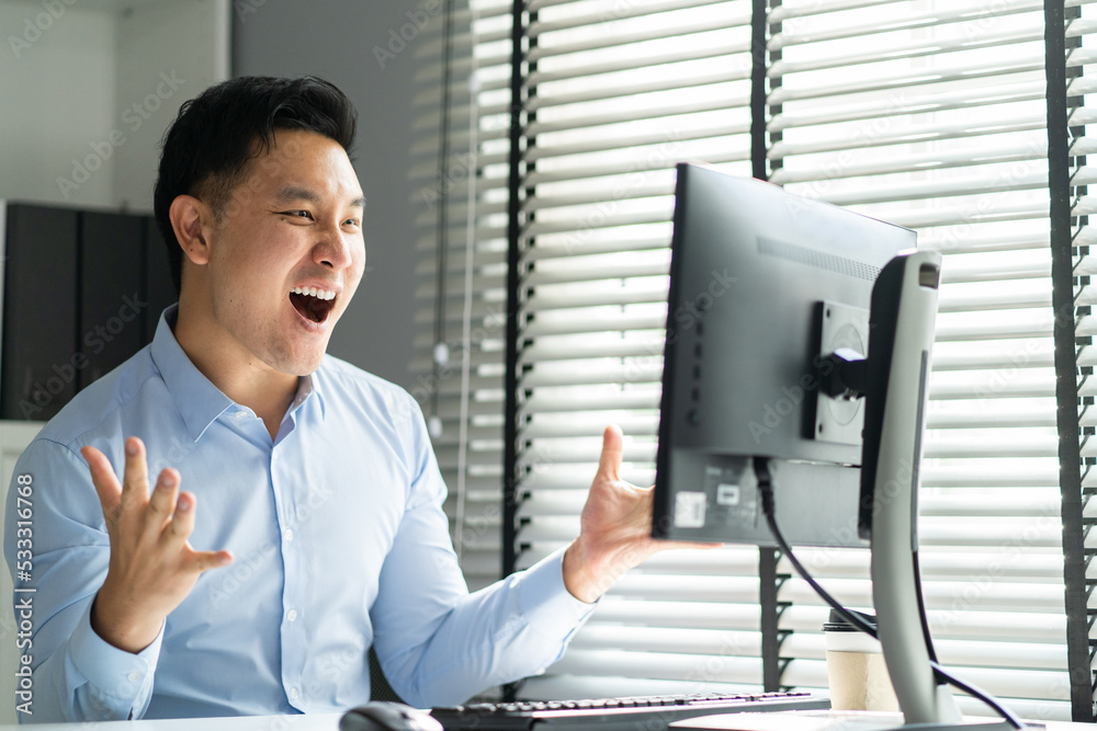 Asian handsome business man using laptop computer working in office