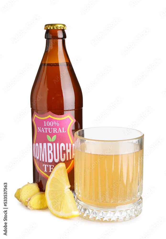 Bottle and glass of delicious kombucha tea on white background