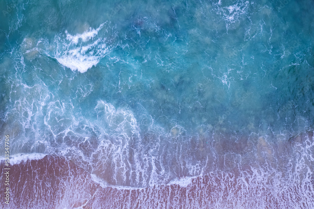 Aerial view drone over beach sea, Beautiful sea waves background, Beach sand sea surface, Summer sea