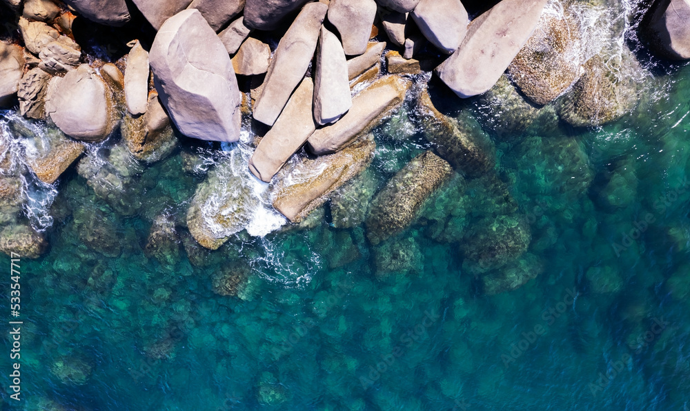 Aerial view of waves crashing on rocks,Seascape birds eye view photo shot over ocean waves, Image fo