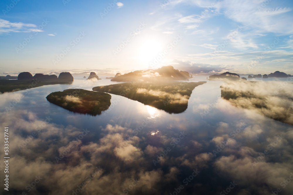 Aerial view panorama shot of beautiful lake against sunset or sunrise sky with mountain forest Lands