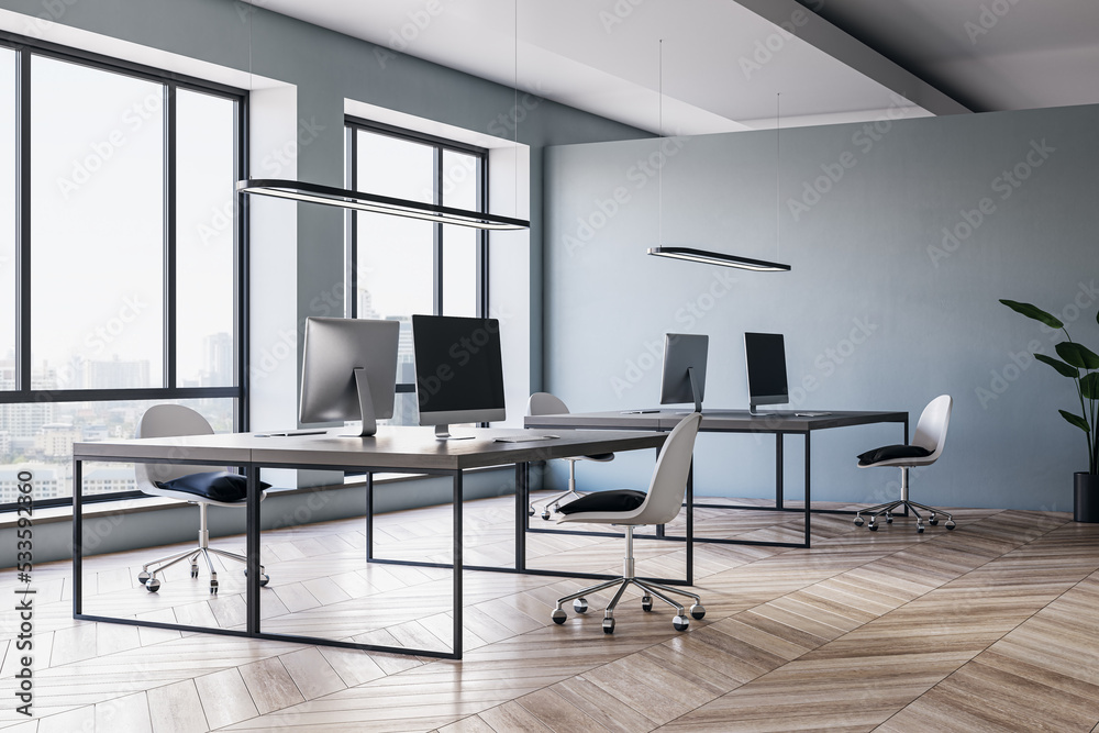 Contemporary meeting room office interior with wooden flooring, furniture, computers, window with ci