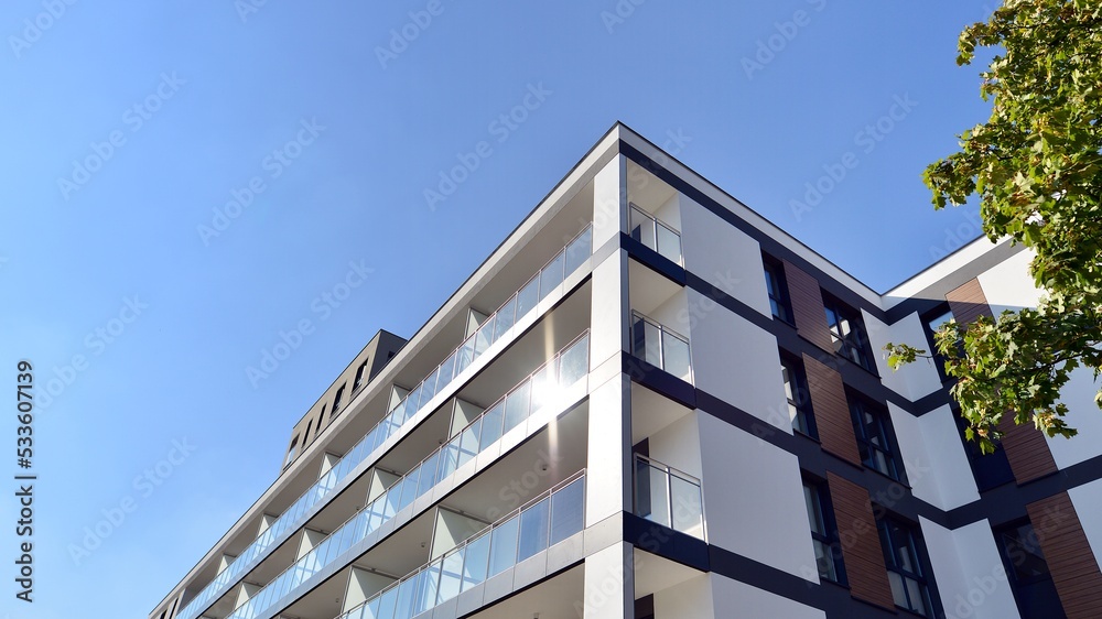 Modern residential building with new apartments in a green residential area. Eco architecture. Green