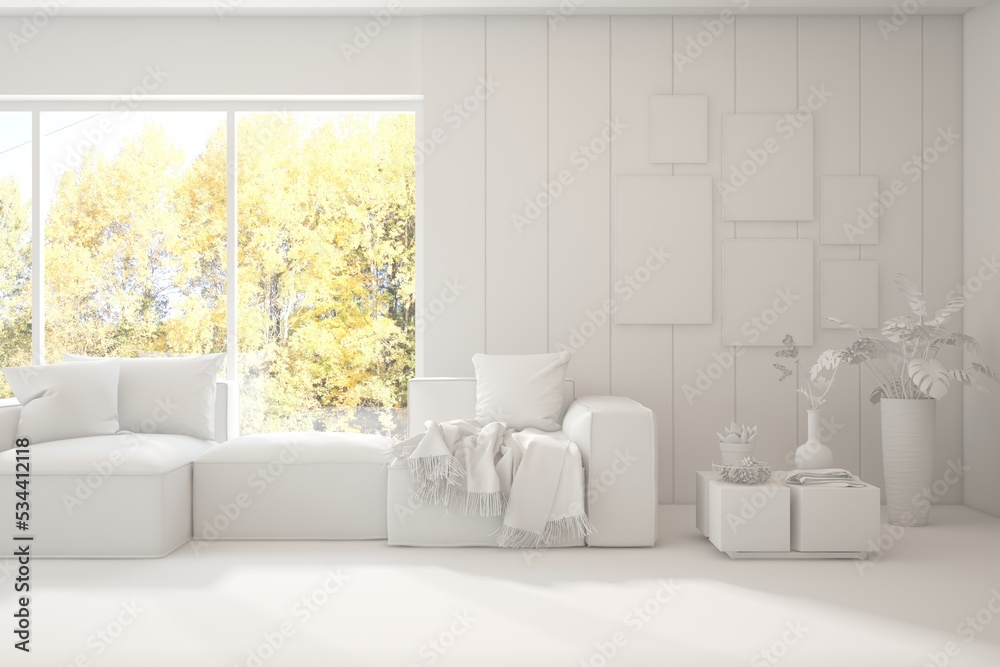 Stylish room in white color with sofa and autumn landscape in window. Scandinavian interior design. 