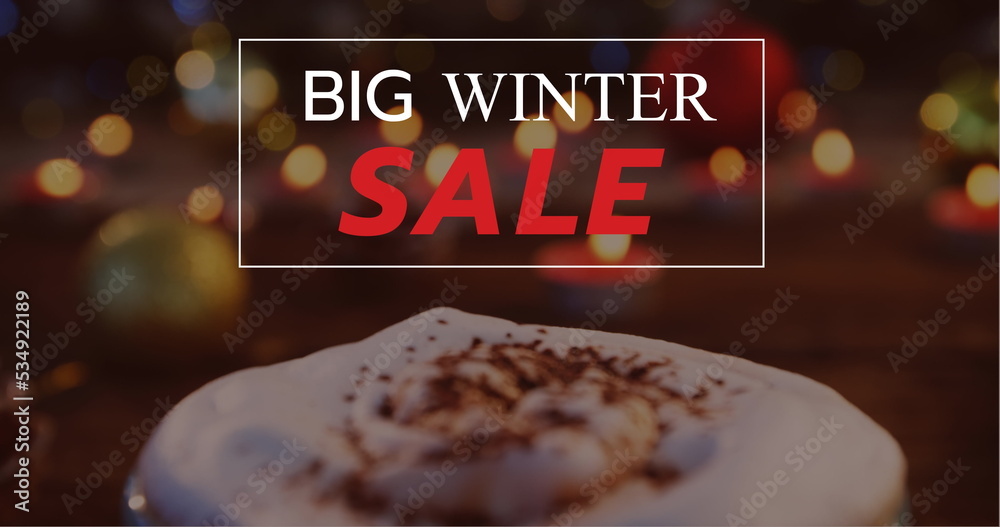 Composition of big winter sale text over christmas hot chocolate decoration in background