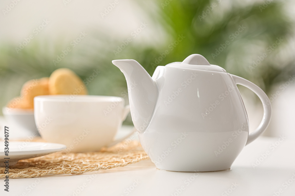 Tea pot on table in cafe