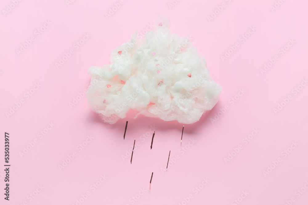 Composition with cotton candy cloud on pink background