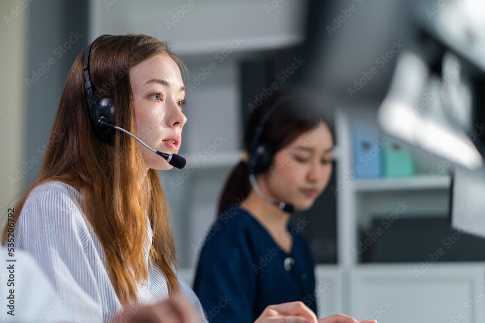 Beautiful Caucasian businesswoman call center work in office corporate. 