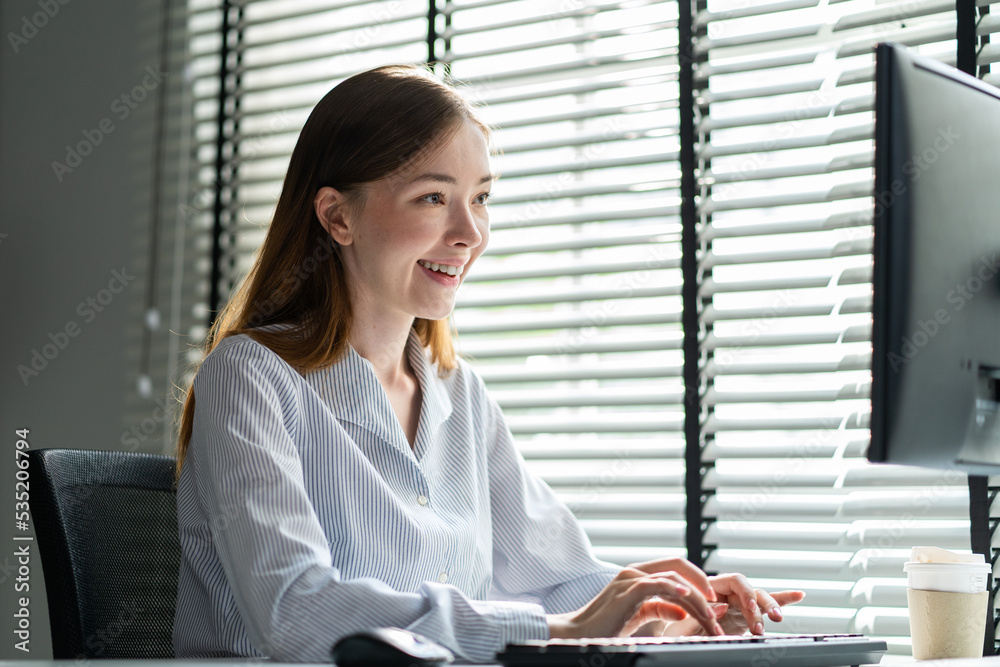 Caucasian beautiful business woman typing laptop keyboard in office. 