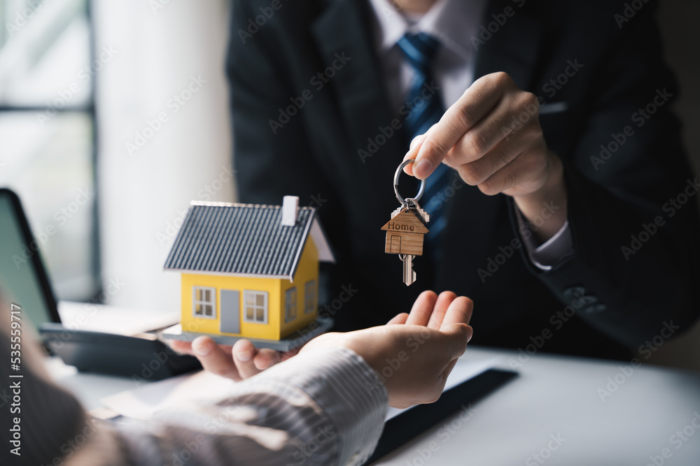 Real estate agent offer hand for customer sign agreement contract signature for buy or sell house.