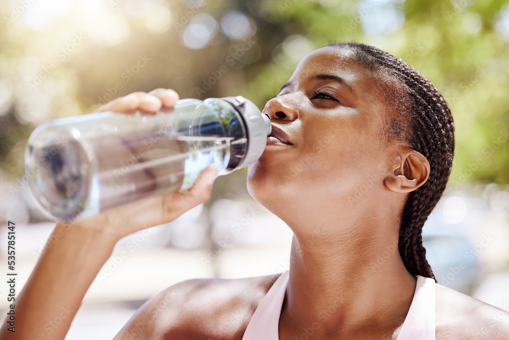 Woman, exercise and drink water outdoor, while running or training in the summer. Lady, workout and 