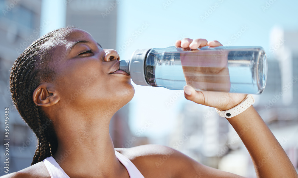 Water bottle, fitness and black woman outside in city for exercise, training and a run for, health w