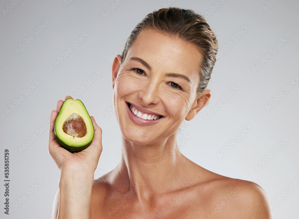 Natural skincare, senior woman with avocado and happy studio portrait. Facial treatment, nutrition i