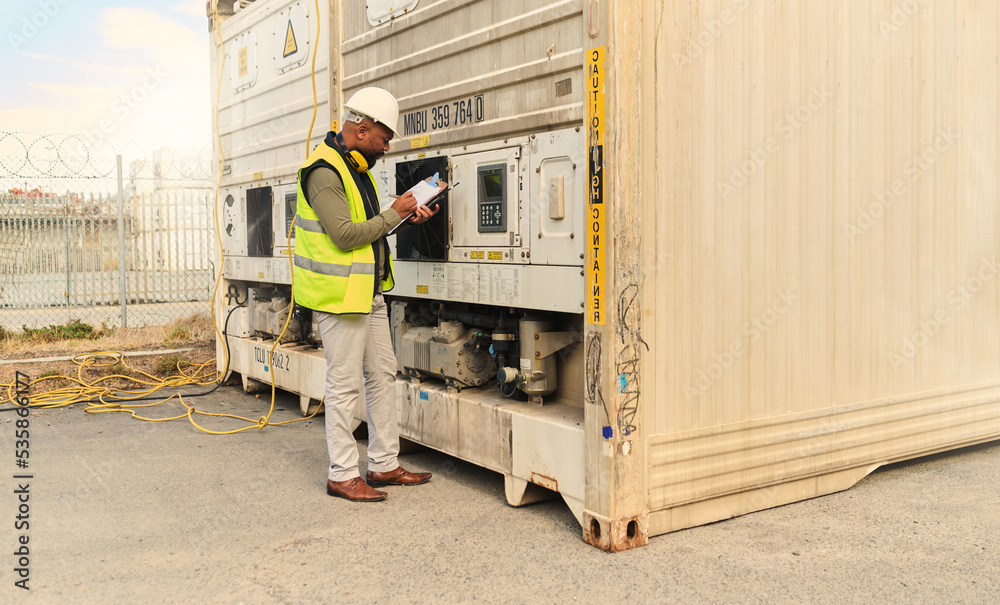 Mechanic, black man and refrigerator checklist for container cargo maintenance at shipping yard. Pro