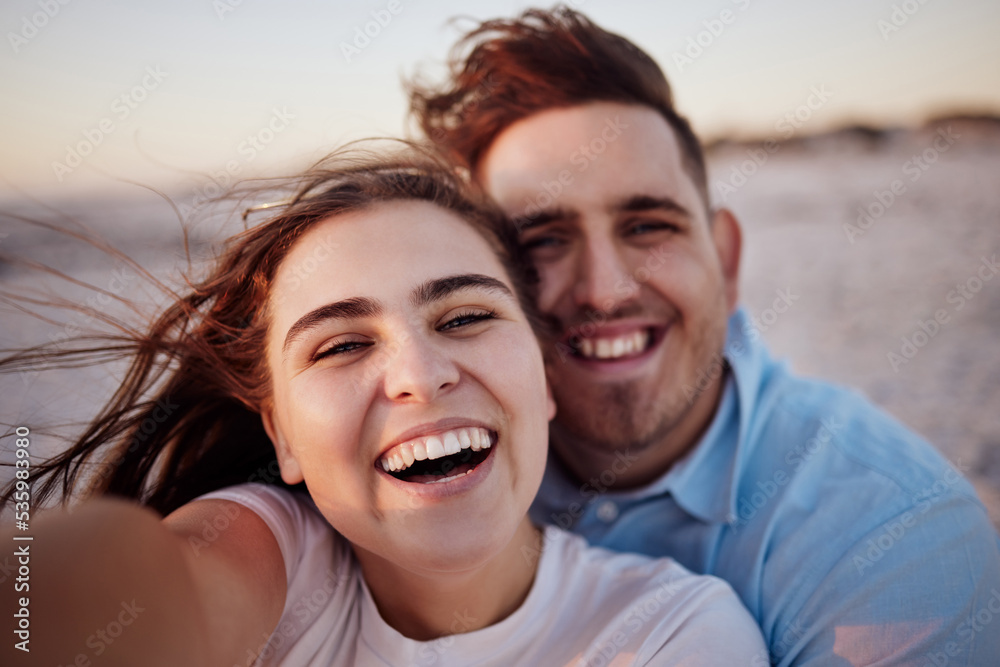 Couple, smile and beach together for selfie with happiness on face on holiday, honeymoon or vacation