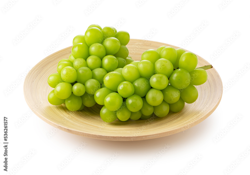 Shine Muscat grapes on a white background.