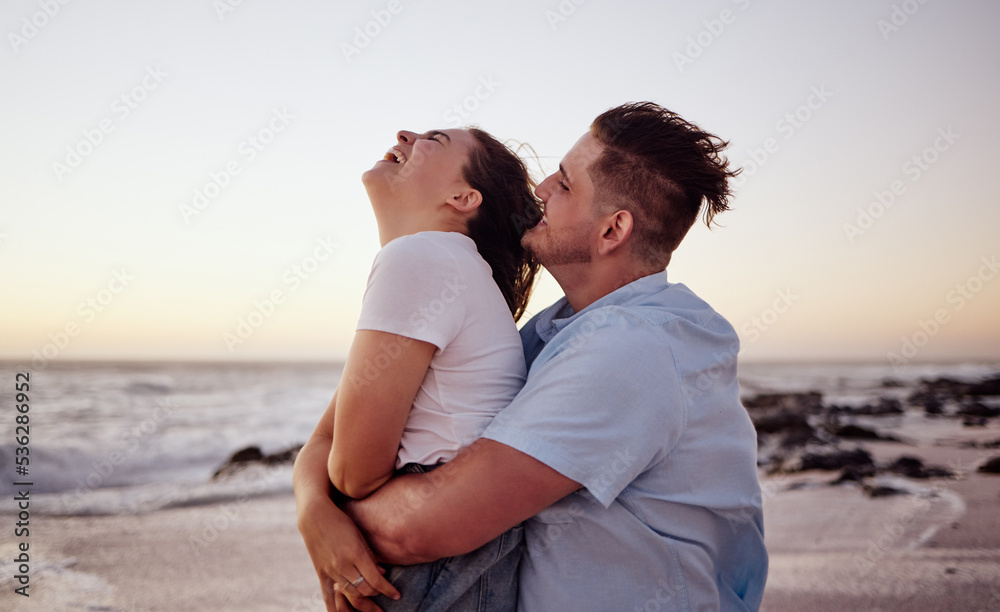 Sunset, love and young couple on the beach bonding, laughing and enjoying their honeymoon holiday. H