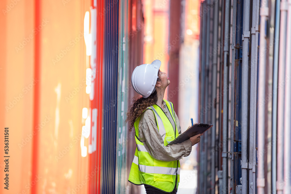 Inspector checking container yard Organising stock to pack into containers,Logistic shipping yard bu