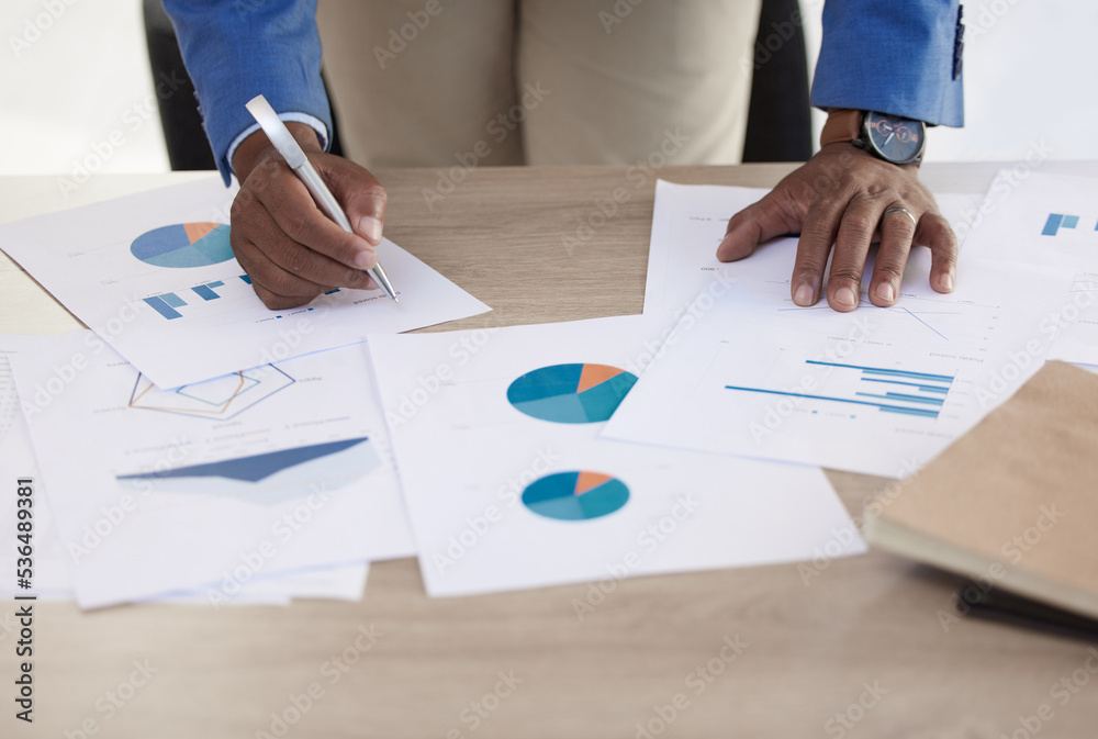 Businessman, hands and data on paper, analytics and graph for accounting in finance business on desk