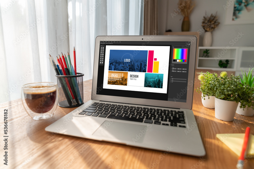Graphic designer software for modern design of web page and commercial ads showing on the computer s