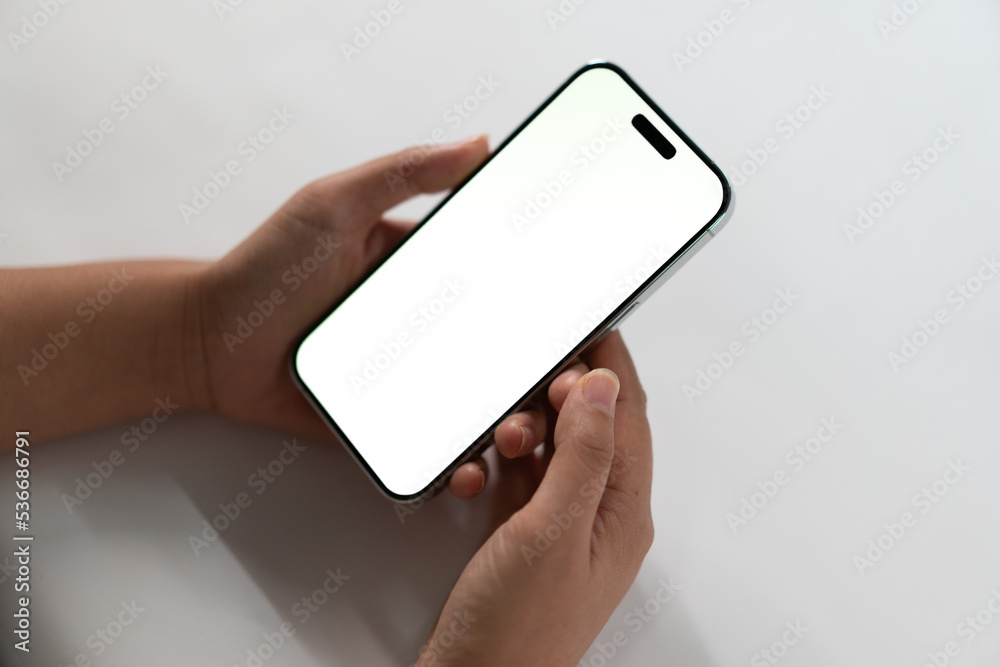 woman using smartphone in office