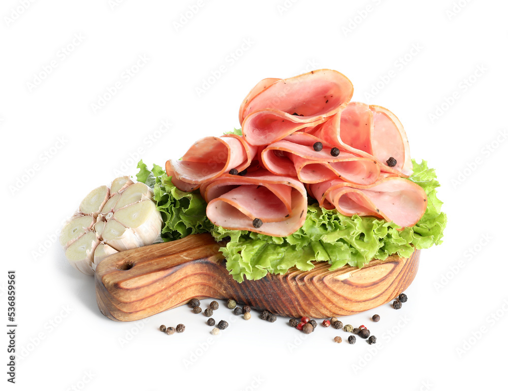 Wooden board with slices of delicious ham and lettuce on white background