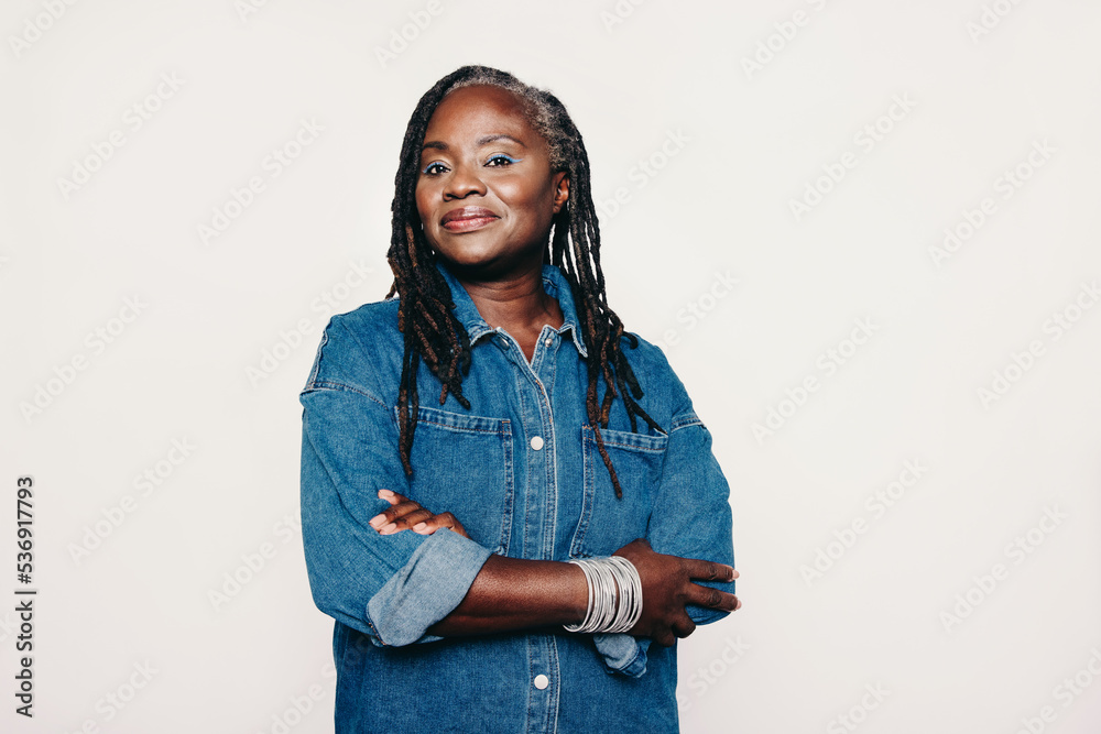 Stylish mature woman looking at the camera in a studio