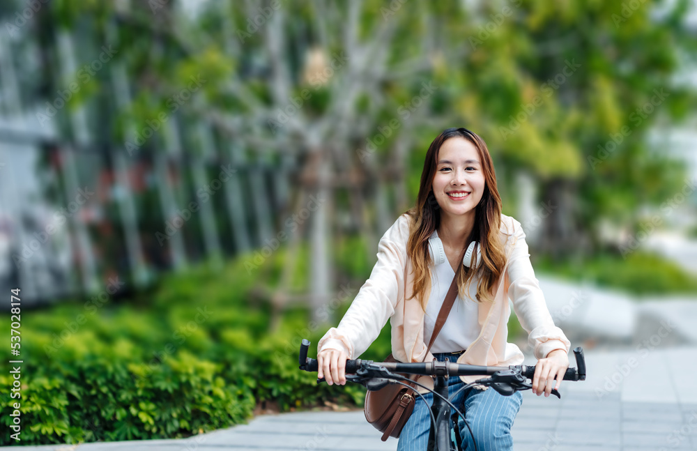 Beautiful Asian woman listening favourite music on headphones from mobile phone, Happiness relaxatio