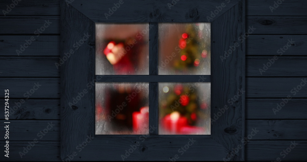 Image of window with blurred christmas tree and decorations